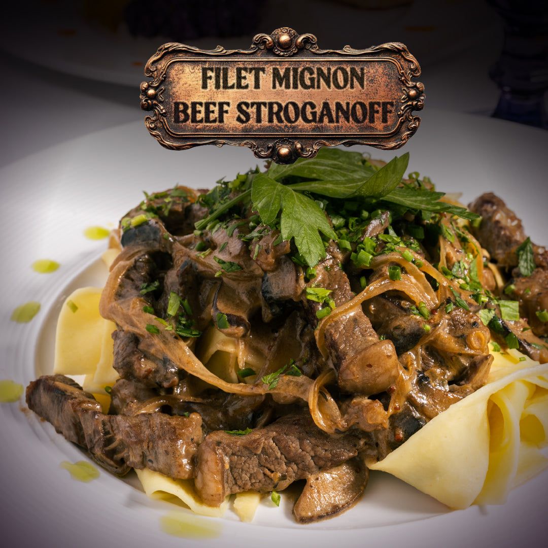 Plated dish of Filet Mignon Beef Stroganoff with a decorative sign above it.