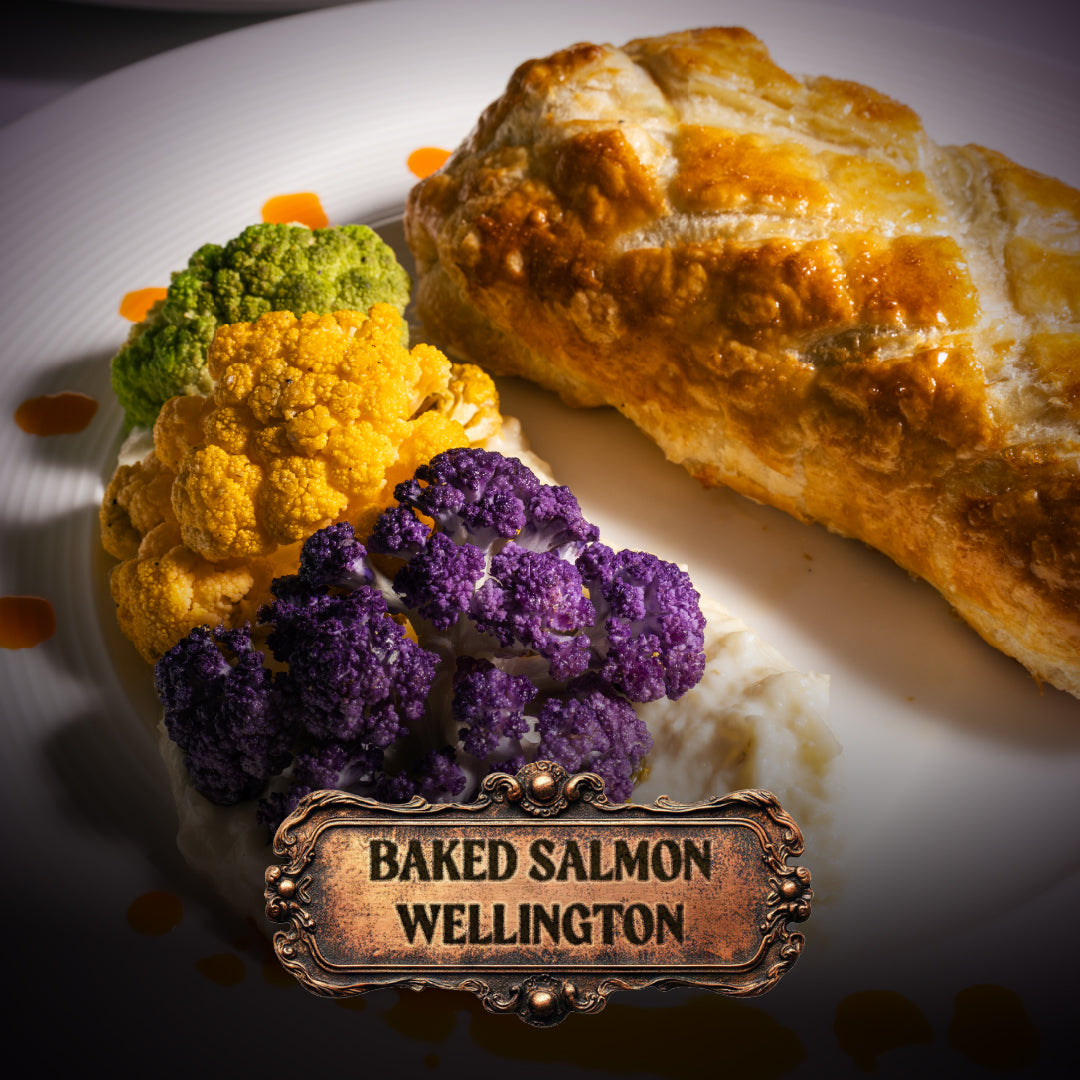 Baked Salmon Wellington with roasted vegetables on a plate