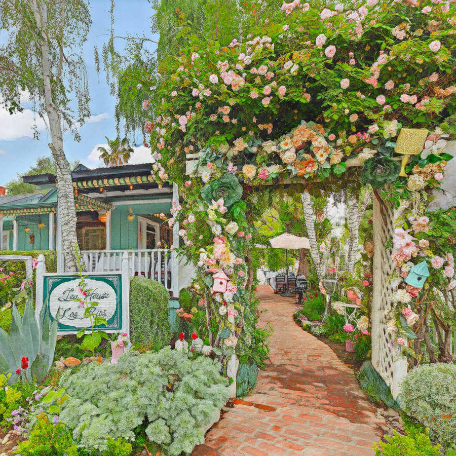 The Tea House on Los Rios front arch with flowers and brick pathway to afternoon tea experience