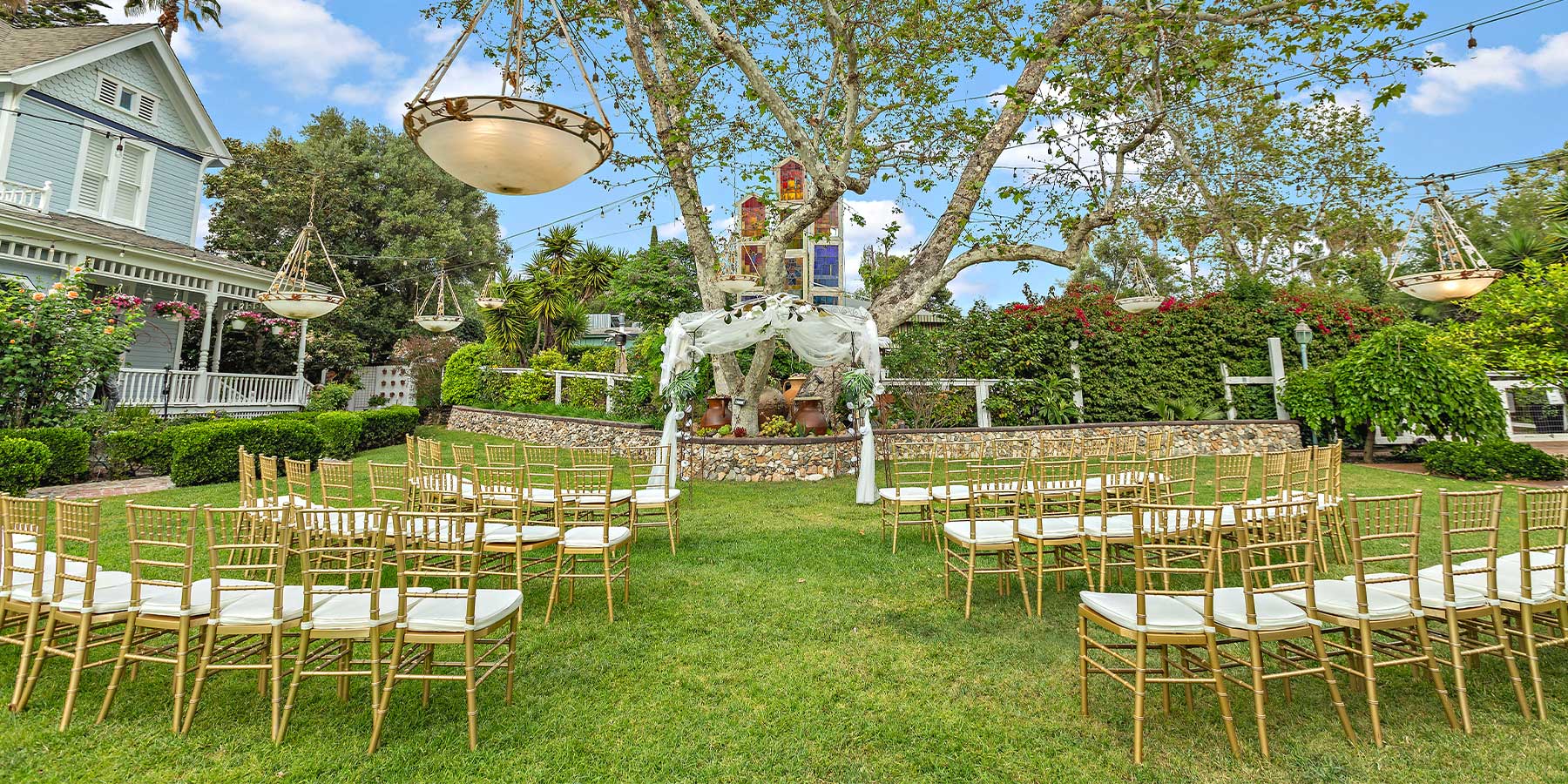 Victorian lawn wedding venue with chairs for ceremony 