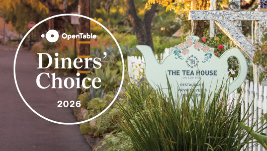 Tea house sign with OpenTable Diners' Choice 2026 logo in a garden setting