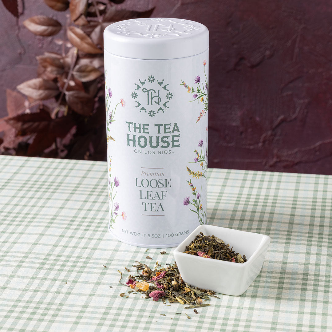 Green Tea on a tabletop with a Tea House on Los Rios Tea Tin.