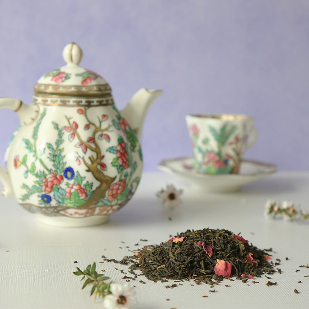 Green Loose Leaf Tea with Floral Tea Pot and Tea Cup