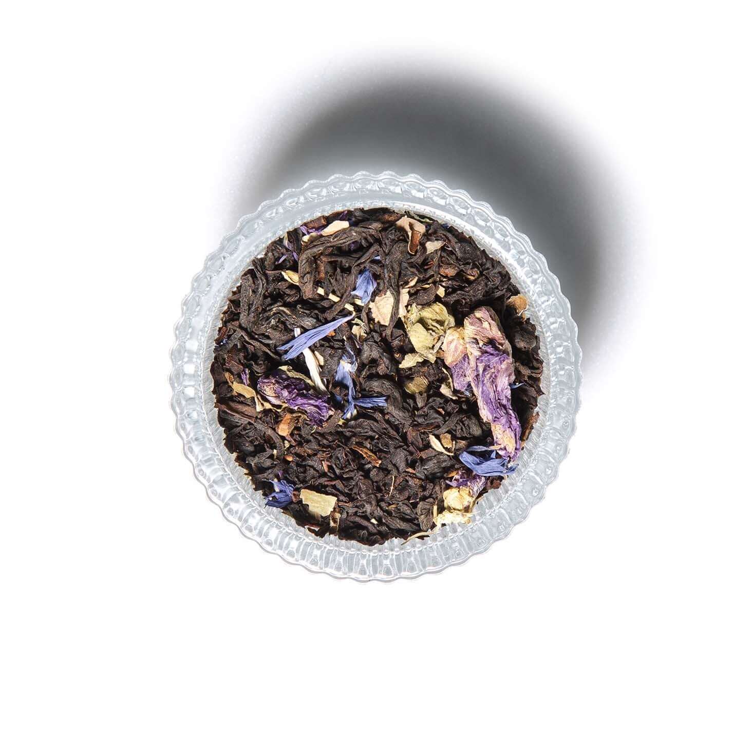 Cream of Earl Grey tea with tea cup and loose tea