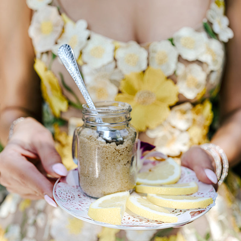gorgeous woman holding a plate of brown sugar at tea time