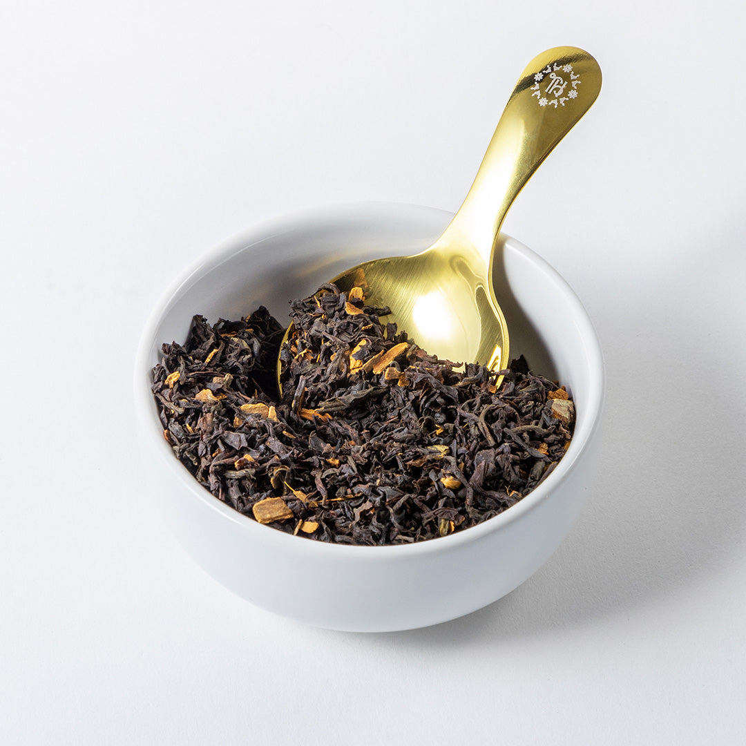 Loose Leaf Tea Scoop in a bowl of loose leaf tea