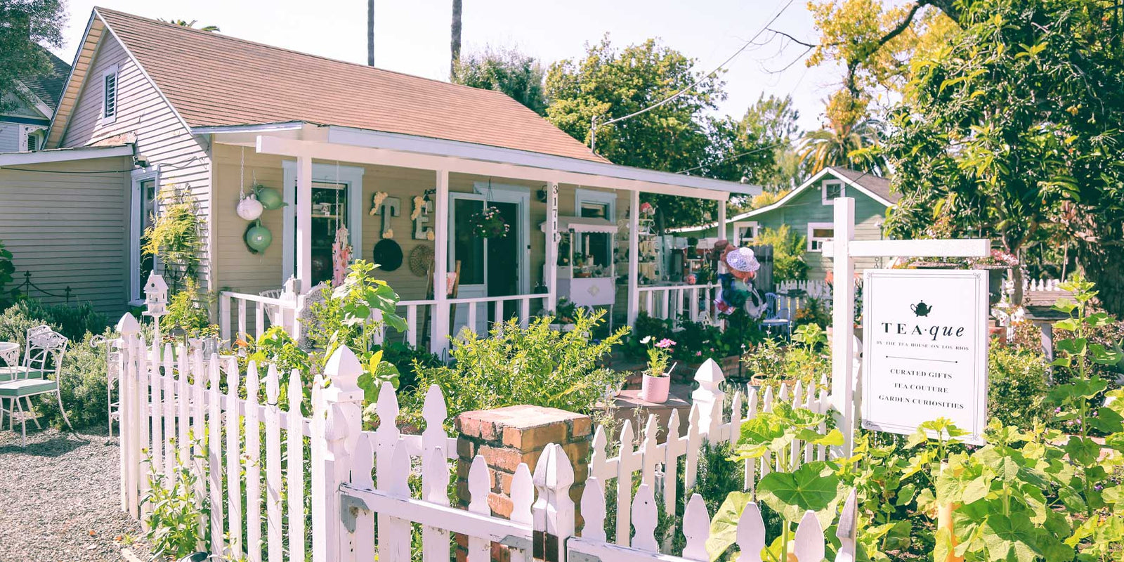 TEAque gift shop, view from the street showing the front of the store and the garden
