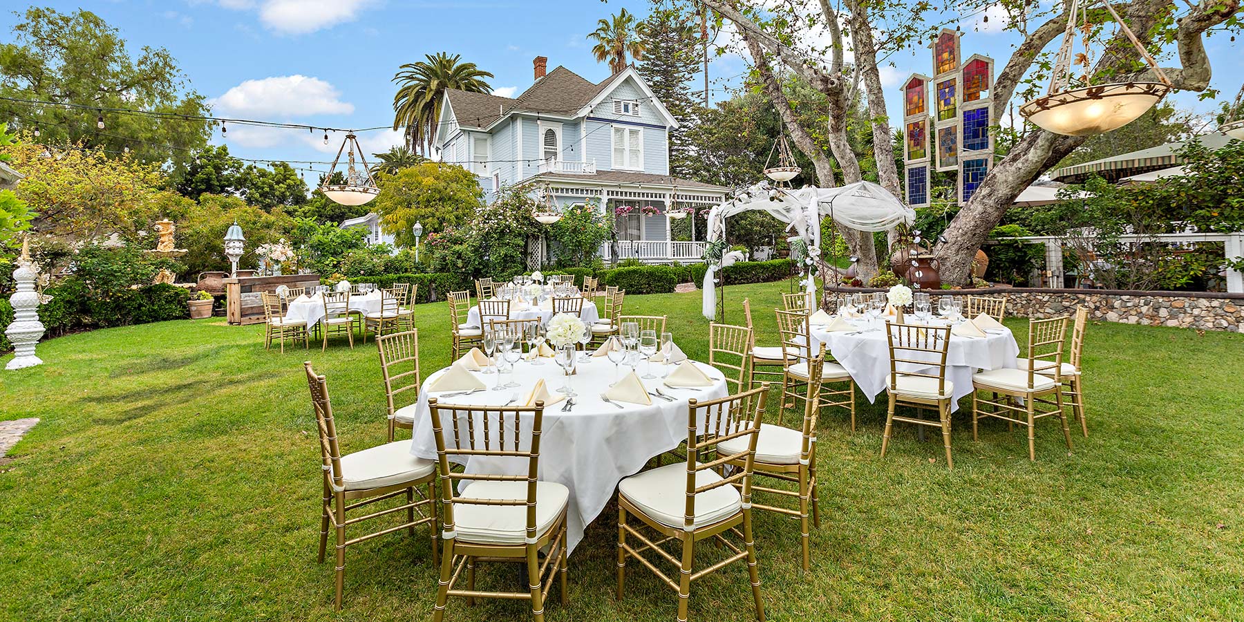 Victorian Lawn with tables and chairs for wedding reception